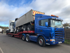 blue scania artic lowloader with 2 units