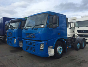 2 blue volvo fm12 units side by side