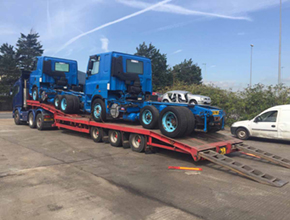 2 blue daf units on lowloader