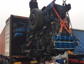 volvo fm12 engine and chassis being loaded into container
