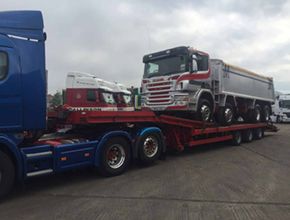 blue scania artic lowloader with scania tipper