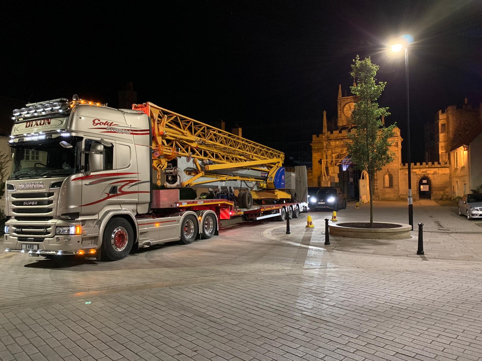 Silver truck with a crane