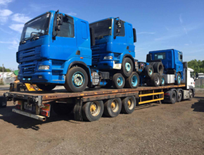 3 blue cabs on trailer