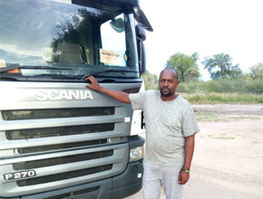 man infront of scania