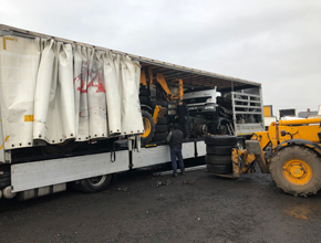 Trailer being unloaded different shot